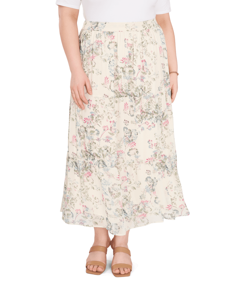 Front of a model wearing a size 1X Tiered Ruffle Dandelion Skirt in NEW IVORY by Vince Camuto. | dia_product_style_image_id:261309
